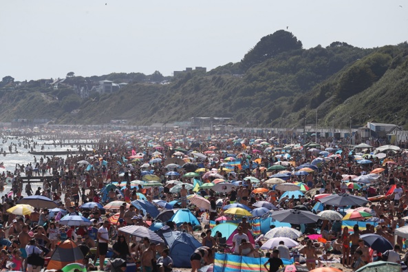 People are seen on the beach on the hottest day of the year, after an easing of social restrictions due to coronavirus, in Bournemouth, England, Wednesday, June 24, 2020. Photo / AP