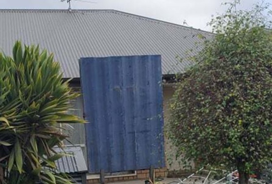 A Christchurch social housing tenant claims her neighbours built this shield after two shootings at the property.