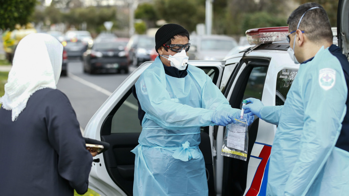 Paramedics perform Covid-19 tests in Broadmeadows after Victoria State Government Health and Human Services people knock on doors to check if people have any symptoms of and would like a test. (Photo / AAP)