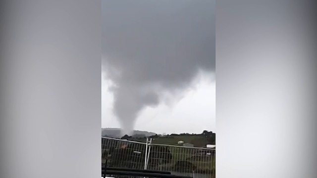 A small tornado has lifted rooves and caused other damage in Mangawhai, north of Auckland. Video / Supplied