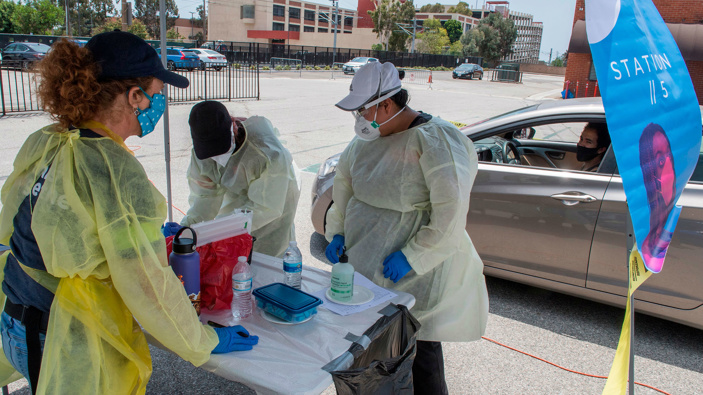 Medical staff from myCovidMD provide free COVID-19 virus antibody testing in Inglewood, California. (Photo / Getty)