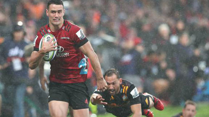 Will Jordan escapes the clutches of Aaron Cruden for his second try. Photo / Photosport