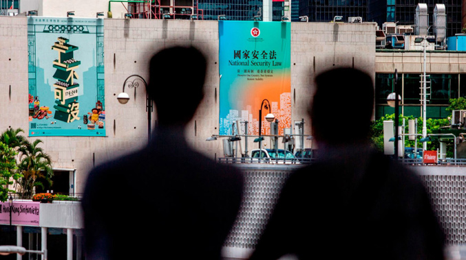 A government advertisement (center) promoting Chinas planned national security law is displayed on the city hall building in Hong Kong. (Photo / Getty)