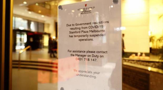             Signage outside the Stamford Plaza announcing the suspension of operations. Photo / Getty Images
