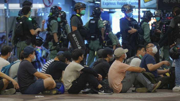 Police detain protesters during a march marking the anniversary of the Hong Kong handover from Britain to China. (Photo / AP)