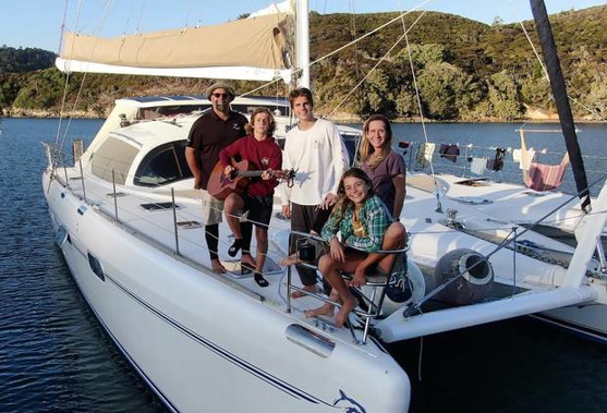 The Whitaker family from Texas on board their catamaran Zatara anchored off New Zealand during their voyage around the world. Photo / Supplied