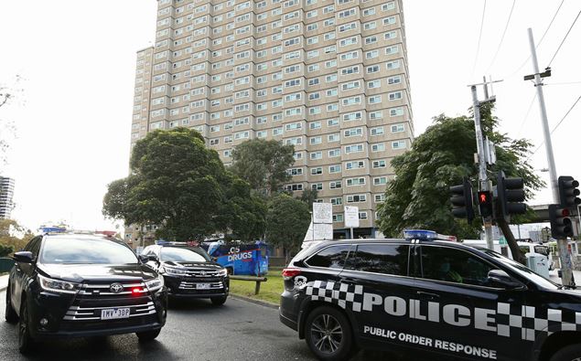Police are enforcing a lockdown at public housing towers in Melbourne after Victoria recorded new coronavirus cases. (Photo / AAP)