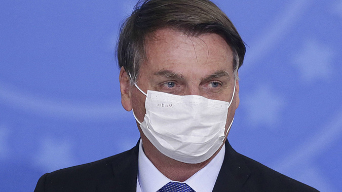 Jair Bolsonaro has long been downplaying the seriousness of Covid-19. (Photo / AP)
