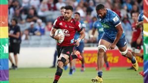 Richie Mo'unga runs in a try against the Blues. Photo / Getty