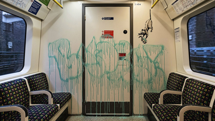 Enigmatic graffiti artist Banksy uploaded a video to social media on Tuesday of what appeared to be him in disguise as a professional cleaner spray painting images of rats on the inside of a London Underground train along with messages about spreading the new coronavirus. 