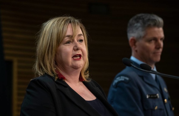 Minister in charge of isolation hotels Megan Woods and Air Commodore Digby Webb. (Photo / NZ Herald)