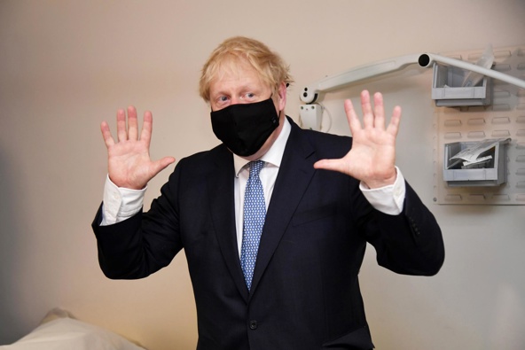 UK Prime Minister Boris Johnson wears a face mask as he visits Tollgate Medical Centre in London on July 24, 2020.
