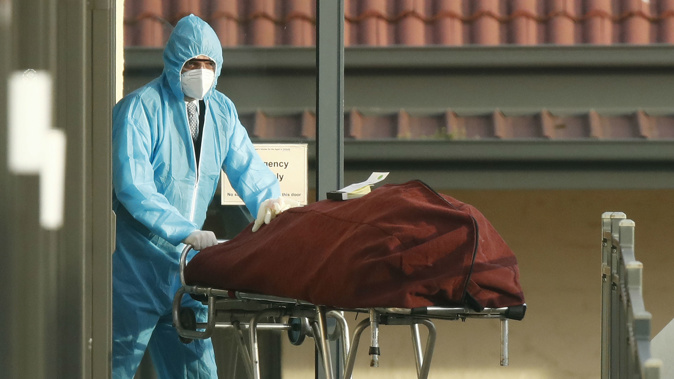 A body is removed from St Basil’s Homes for the Aged in Fawkner, Melbourne, Friday, July 31, 2020. (Photo / AAP)