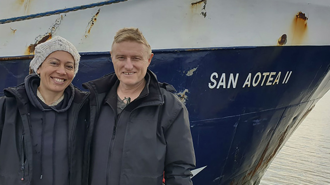 Neville and Feeonaa Clifton are pictured by the San Aotea II fishing boat in the Falkland  Islands. (Photo / Supplied via AP)