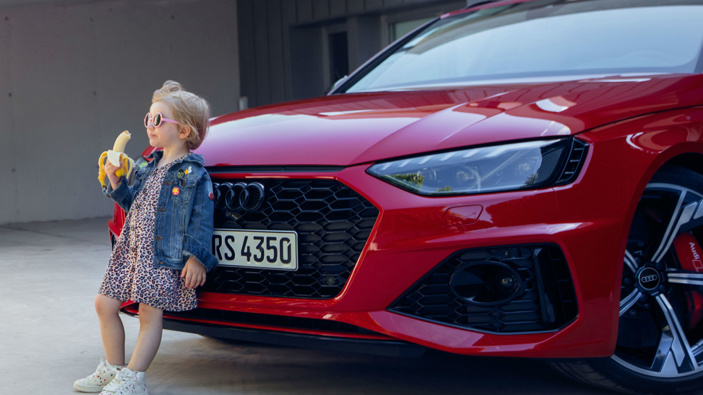 Audi has apologized for an advert showing a young girl eating a banana in front of a premium car. (Photo via CNN)
