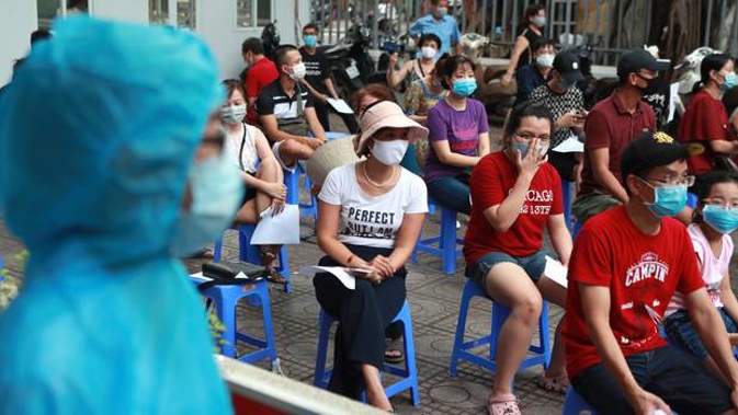 People wait in line for Covid-19 testing in Hanoi, Vietnam. Photo / AP