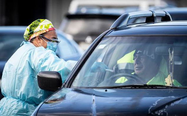 A man is tested for Covid-19 at the Otara Mall testing station. Photo / Greg Bowker