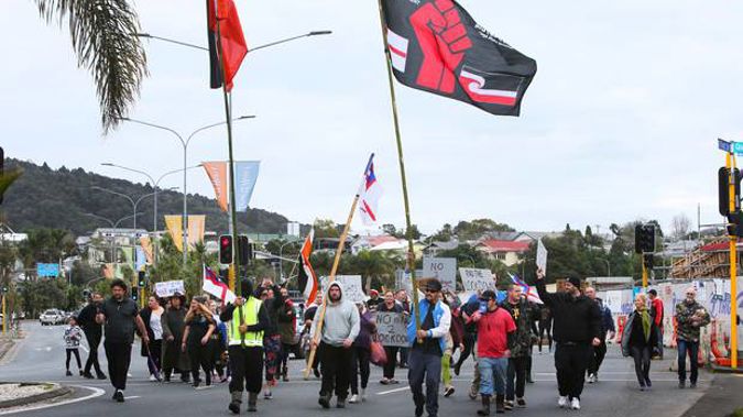 Protesters walk down Dent St in Whangārei. Photo / Tania Whyte