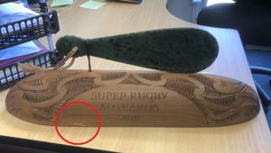 The Super Rugby trophy with damage to bottom left. Photo / Supplied