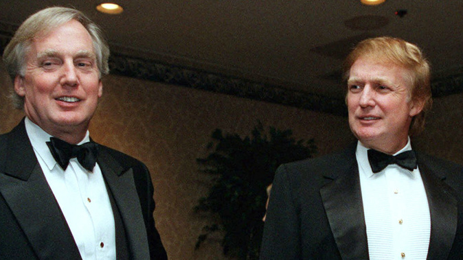 In this Nov. 3, 1999, file photo, Robert Trump, left, joins then real estate developer and presidential hopeful Donald Trump at an event in New York. (Photo via AP)