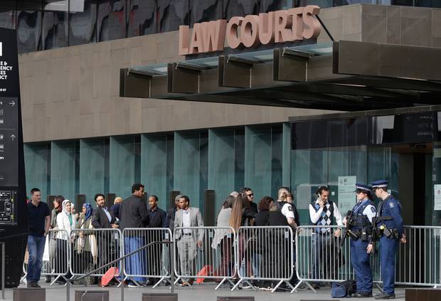 Family and survivors from Christchurch mosque shootings wait to enter the Christchurch High Court. Photo / AP