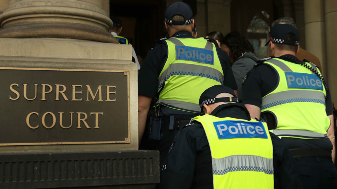 Victorian Police enter the Supreme Court of Victoria in Melbourne. (Photo / Getty)
