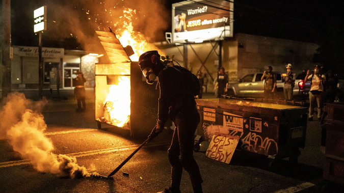 Fires were lit during protests Friday night in Portland. (Photo / Getty)