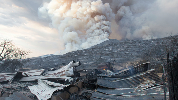 A burned structure is seen at a wildfire in Yucaipa, California, after a couple's plan to reveal their baby's gender at a party. (Photo / AP)