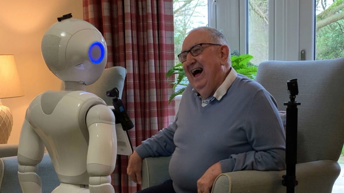 Pepper engages in conversation with a care home resident. Photo / University of Bedfordshire via CNN