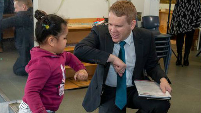 Education Minister Chris Hipkins greeting Alexia Pitoitua, aged 3, at today's education policy announcement at a Porirua childcare centre today. Photo / Mark Mitchell