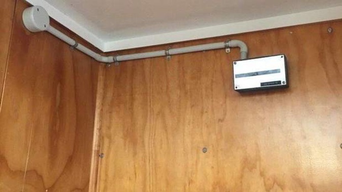 The camera pictured on the wall and inside a box labelled "cable junction box" before it was taken down by the students. Photo / Supplied