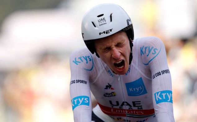 Tadej Pogacar roars after crossing the line in his time trial. Photo / Getty