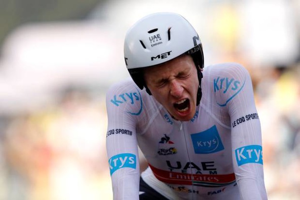 Tadej Pogacar roars after crossing the line in his time trial. Photo / Getty