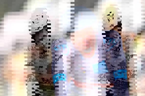 Tadej Pogacar roars after crossing the line in his time trial. Photo / Getty