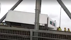 The Auckland Harbour Bridge could be running at a limited capacity for weeks after two trucks were blown over on it on Friday afternoon damaging the superstructure. Photo / Gary Dooley