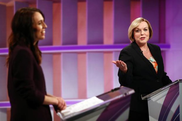 Judith Collins (R) and Jacinda Ardern (L) speak during the live leaders debate in Auckland. Photo / Getty Images