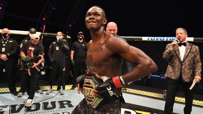 Israel Adesanya celebrates after defeating Paulo Costa to retain his UFC middleweight belt. Photo / Getty