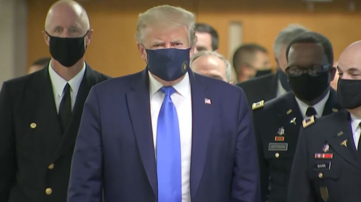 Donald Trump wearing a face mask during an earlier visit to the hospital. (Photo / Pool)