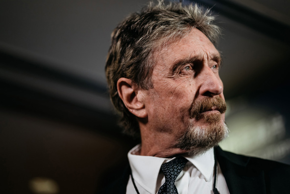 John McAfee, seen here during a Bloomberg Television interview in Hong Kong on Sept. 20, 2017, has been indicted for tax evasion. (Photo / Getty)