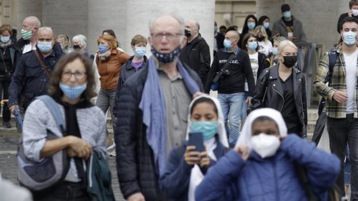 People wear face masks to stop the spread of Covid-19, at the Vatican. Photos / AP