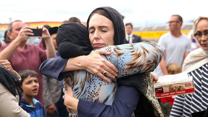 Prime Minister Jacinda Ardern hugs a woman two days after the mosque attacks in Christchurch in March last year. Photo / Hagen Hopkins, Getty