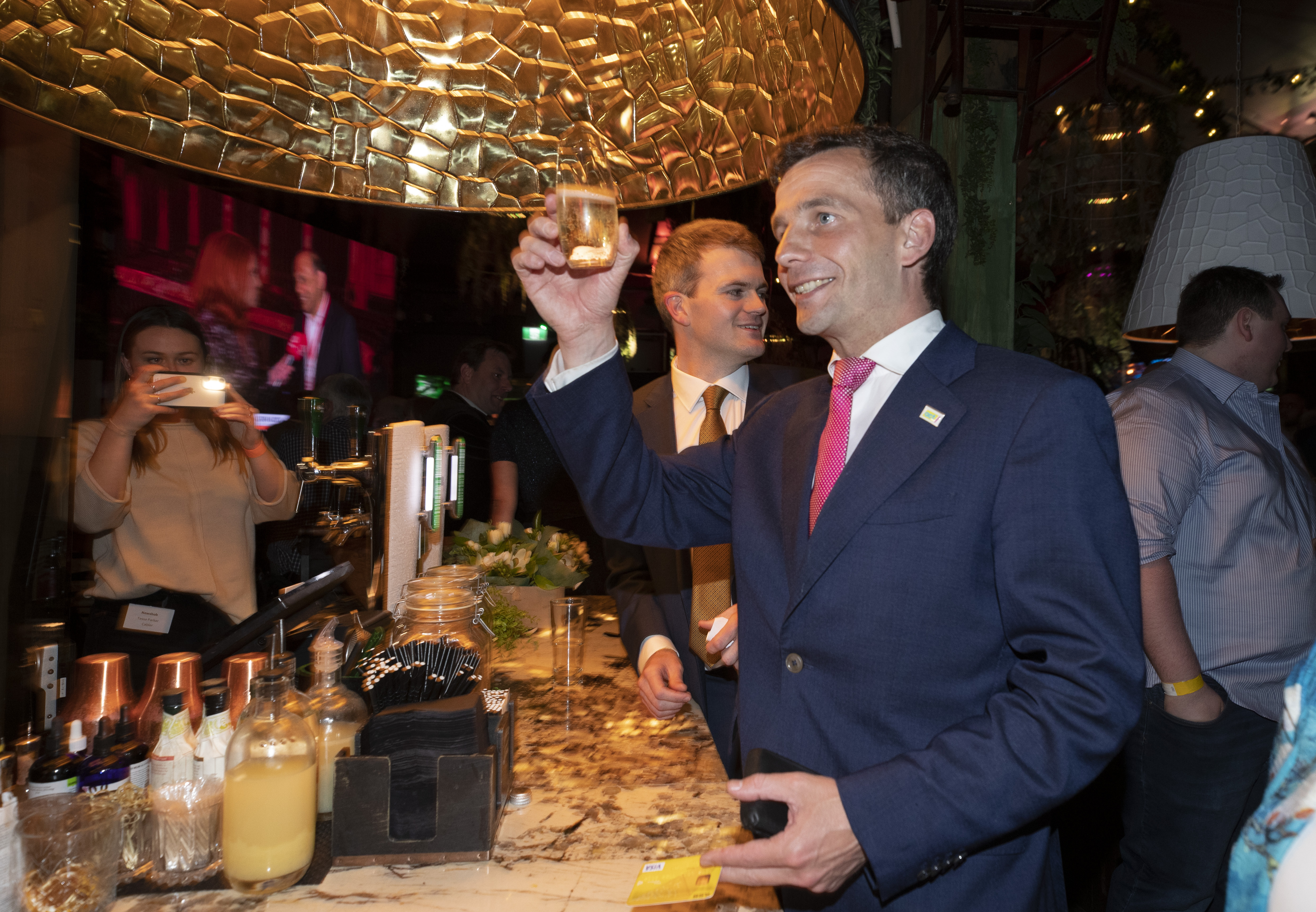 Act leader David Seymour toasts what has been a terrific night for the party. (Photo / Brett Phibbs)