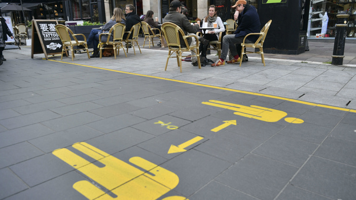 Customers sit in the outdoor seating of bars and cafes in Cardiff prior to Wales entering a "firebreak" lockdown. (Photo / AP)