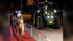 Tom Williams and his ball partner Olivia Horsbrugh made a splash after arriving to their Wairarapa College school ball in a tractor. Photo / Supplied