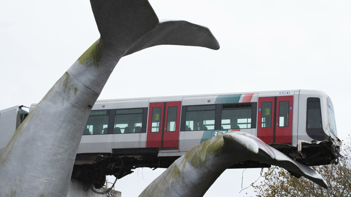 The whale's tail of a sculpture caught the front carriage of a metro train as it rammed through the end of an elevated section of rails with the driver escaping injuries in Spijkenisse, near Rotterdam, Netherlands. (Photo / AP)