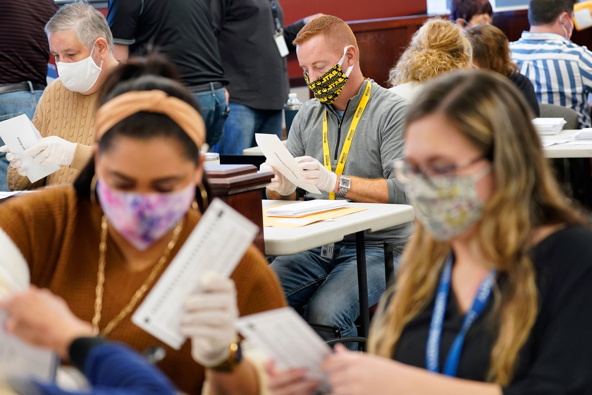 Municipal workers extract Luzerne County ballots from their envelopes, Wednesday, Nov. 4, 2020, in Pennsylvania. (Photo / Getty)