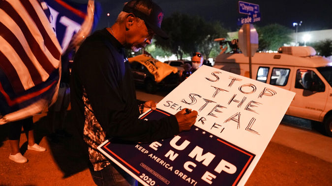 Supporters of President Donald Trump protest in front of the Clark County Election Department, in North Las Vegas. Photo / AP