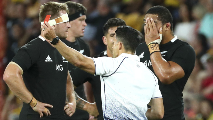 Referee Nick Berry shows a red card to New Zealand's Ofa Tuungafasi, right, for a dangerous tackle during the Bledisloe rugby test.