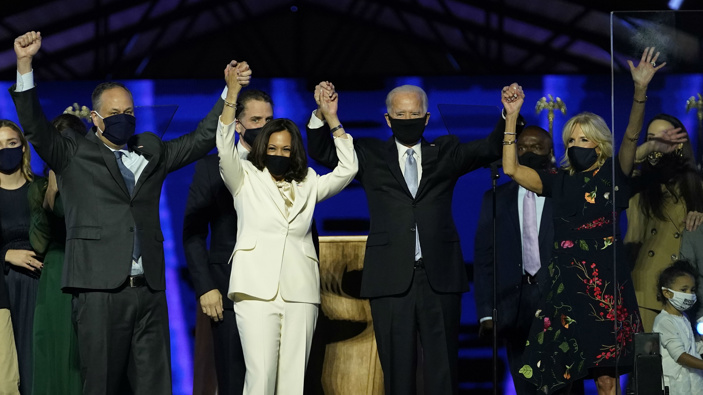 From left, Doug Emhoff, husband of Vice President-elect Kamala Harris, Harris, President-elect Joe Biden and his wife Jill Biden on stage together, (Photo / AP)