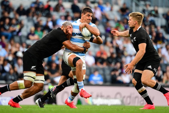 Patrick Tuipulotu and Jack Goodhue of the All Blacks tackle Argentina's Pablo Matera. Photo / Photosport